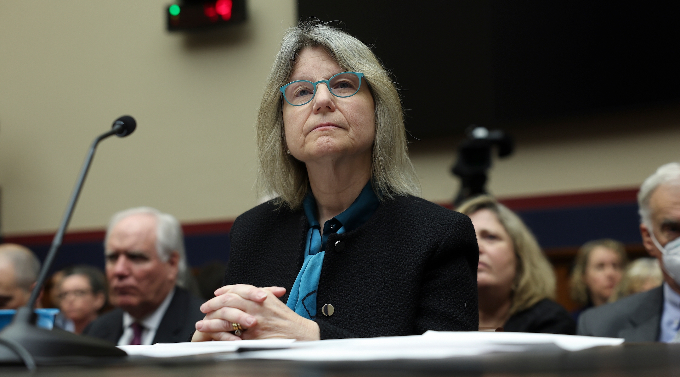 MIT President Sally Kornbluth testifying before the US House with her head bent patiently