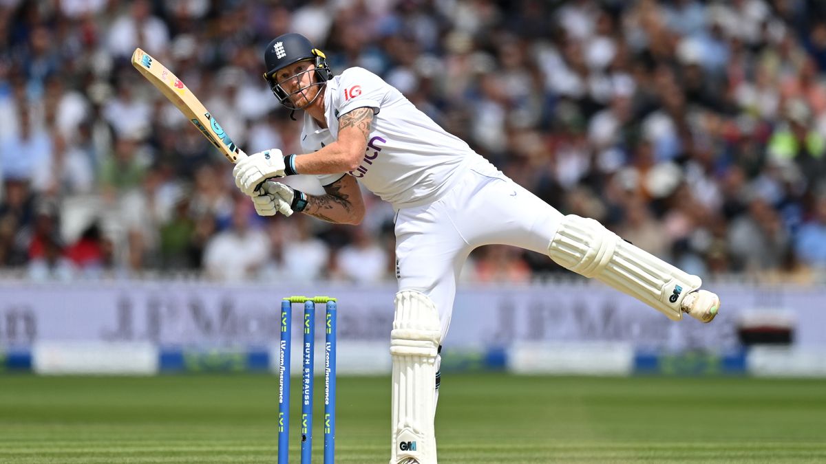 England captain Ben Stokes, dressed in traditional cricket whites and pads, hits out for six ahead of the India vs England Test match 2024.