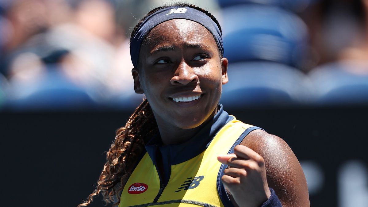 Coco Gauff of the United States, wearing yellow tennis kit, clenches her fist prior to the Dolehide vs Gauff live stream