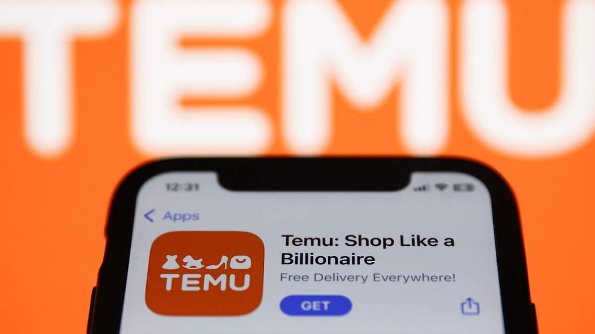 Temu on App Store displayed on a phone screen and Temu logo displayed on a screen in the background ahead of airing of