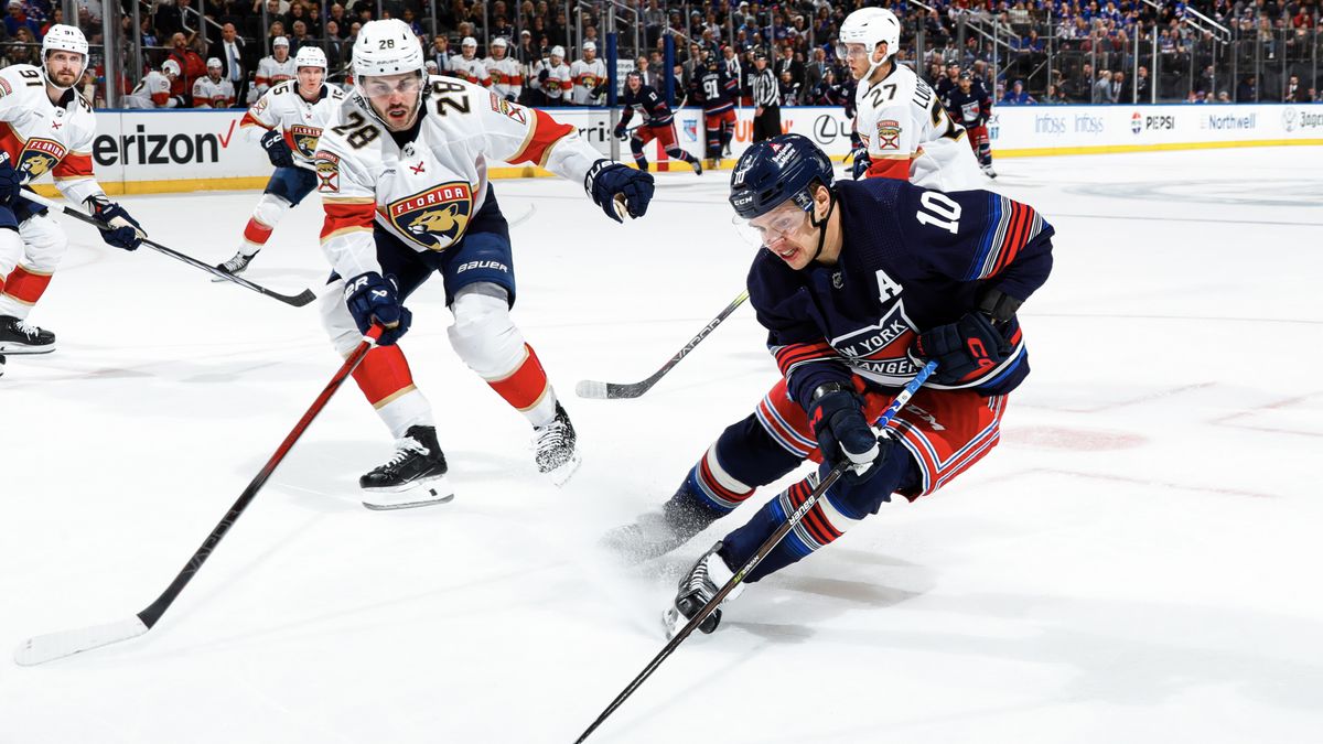 Artemi Panarin #10 of the New York Rangers skates with the puck against Josh Mahura #28 of the Florida Panthers at Madison Square Garden on March 23, 2024 in New York City.