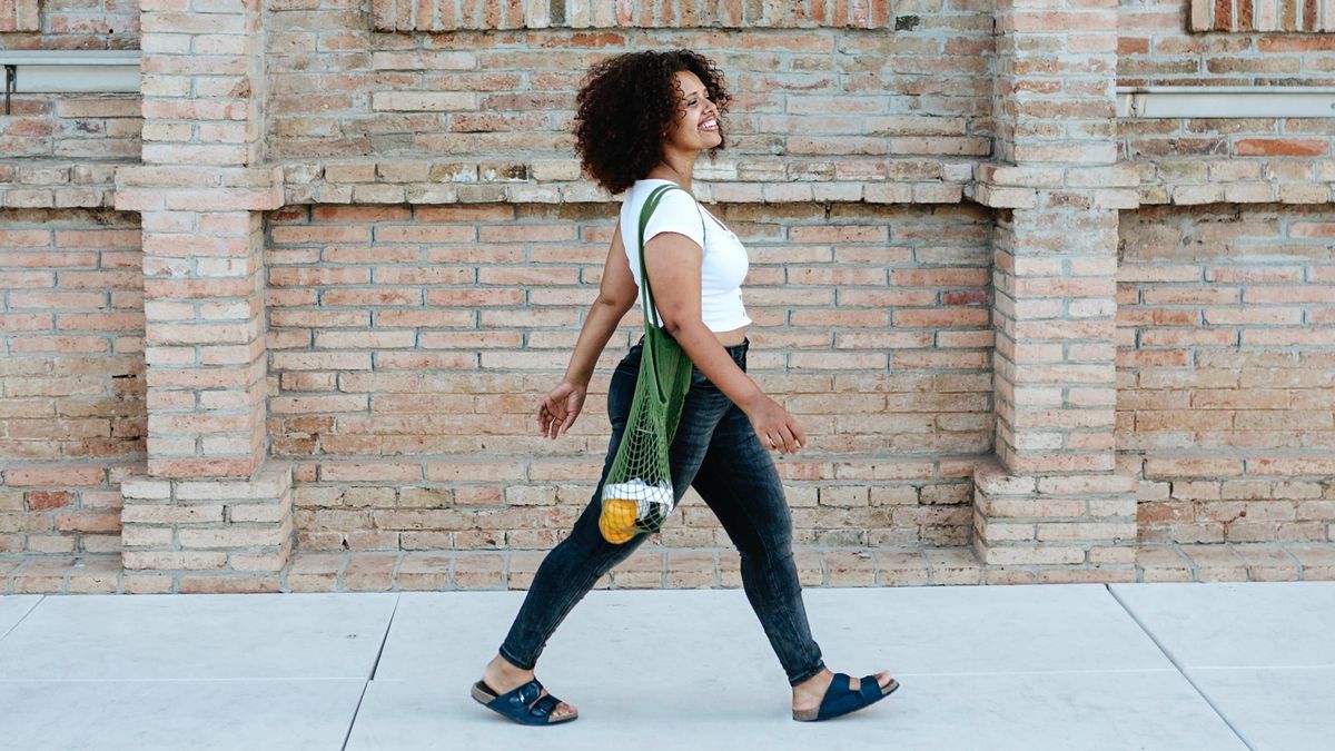 Woman walking briskly outside