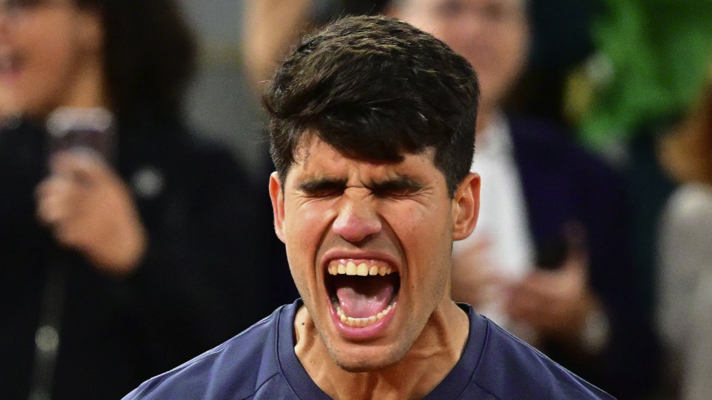 Carlos Alcaraz of Spain celebrates winning match point against Stefanos Tsitsipas of Greece in the Men
