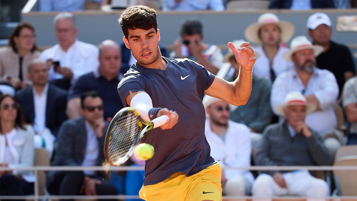 Carlos Alcaraz hits a forehand on his way to winning the French Open final in June 2024