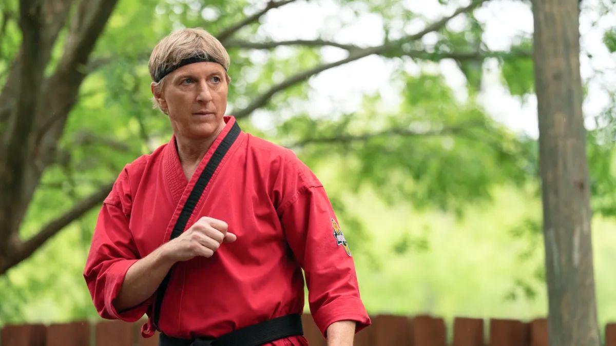 William Zabka in red kung fu attire in