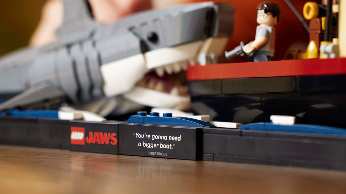 A close-up of the assembled LEGO Ideas Jaws set, showing the plaque bearing the
