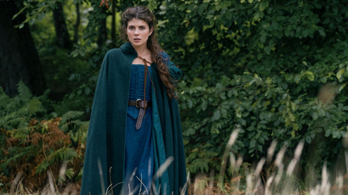 Lady Jane Grey (Emily Bader) in a blue robe and cloak in Prime Video
