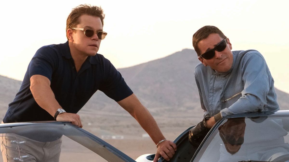 Matt Damon and Christian Bale leaning on a car in