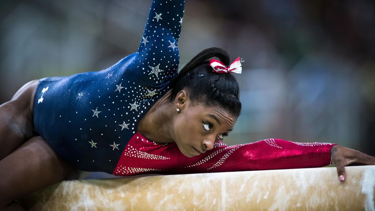 Simone Biles performing in her Team USA leotard