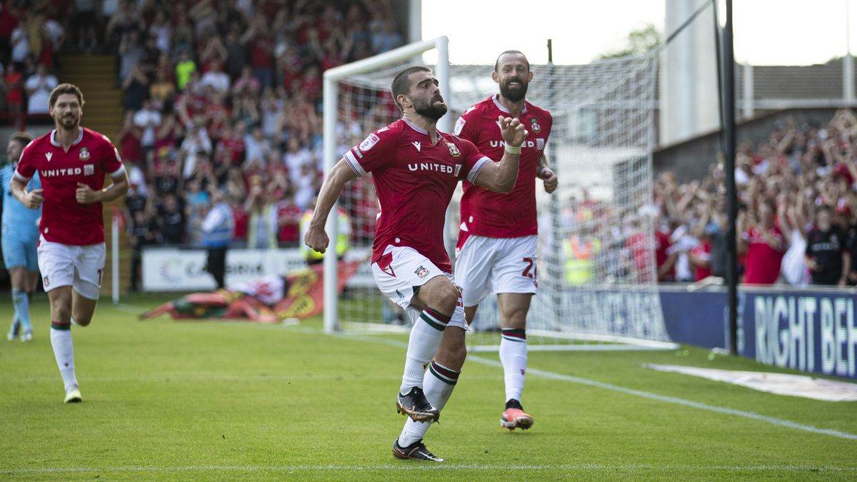 Elliot Lee celebrates a goal for Wrexham in the club