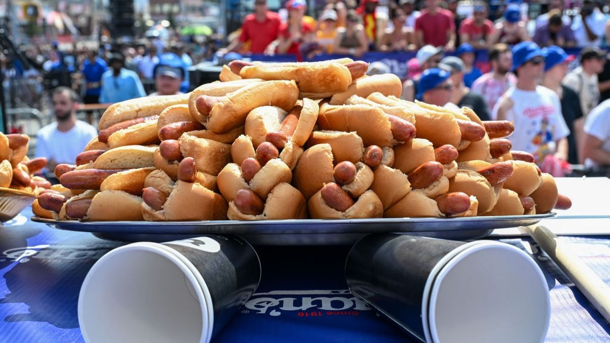 Hot dogs are placed on the competition table ahead of the 2023 Nathan