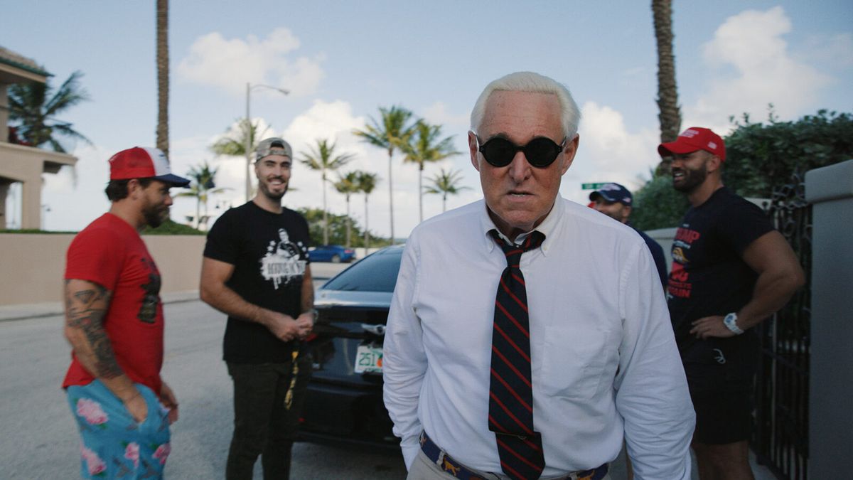 Veteran right-wing political operator Roger Stone [centre] is the focus of