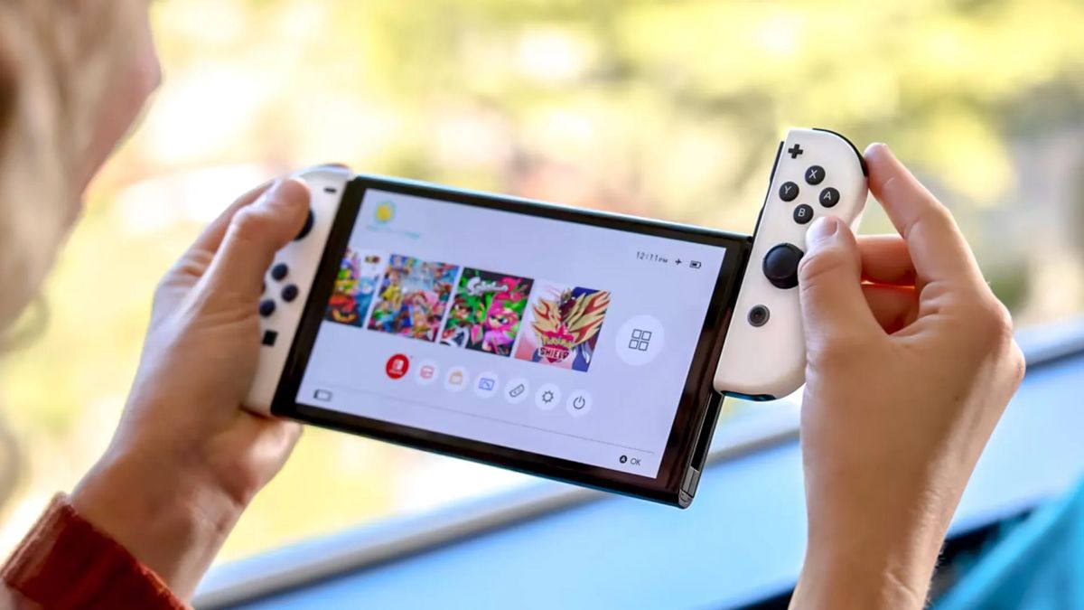 Nintendo Switch OLED being played in Handheld mode.