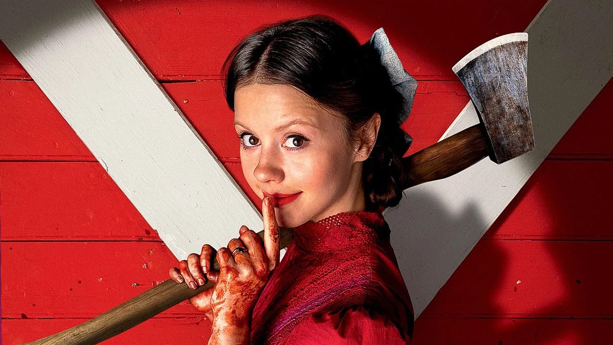 Mia Goth as Pearl, holding an axe in the