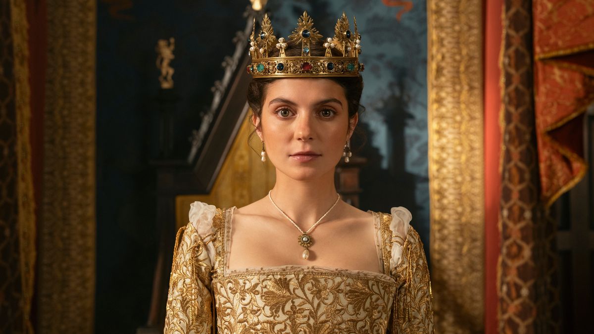 Lady Jane (Emily Bader) wearing the crown and sitting on the throne in Prime Video