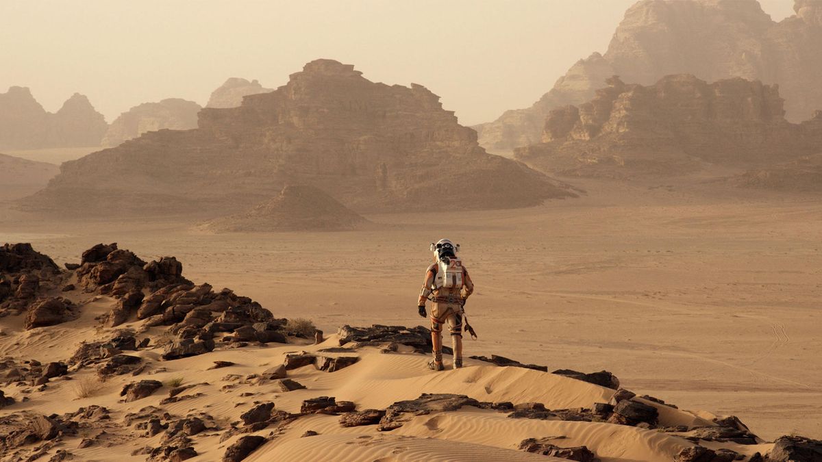 Mark Watney (Matt Damon) walking on the surface of Mars in "The Martian"