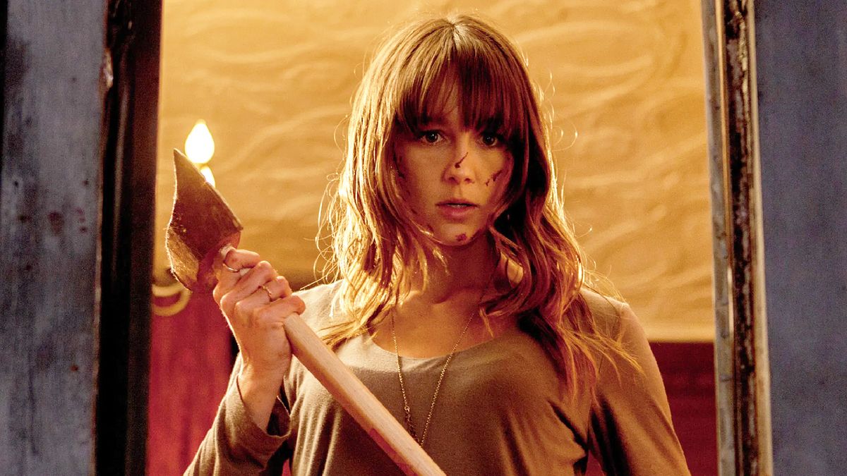 Sharni Vinson as Erin, holding an axe in "You're Next" (2011)