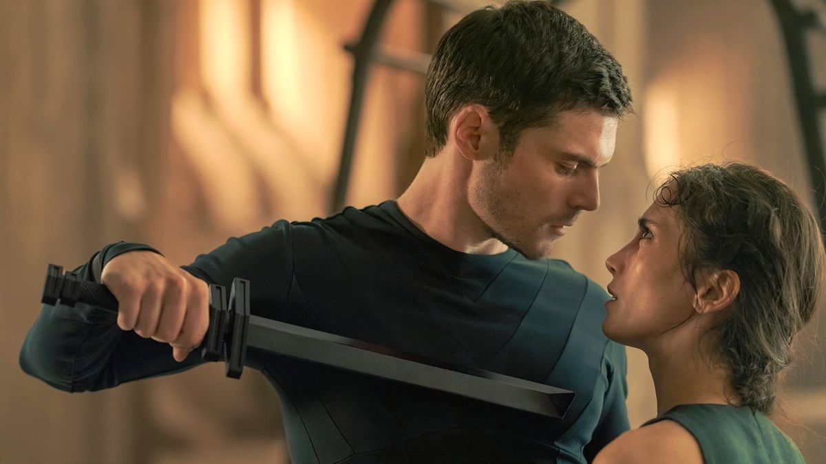 Keiran Atreides (Chris Mason) holds a knife up to Princess Ynez Corrino (Sarah-Sofie Boussnina) in Max's "Dune: Prophecy"