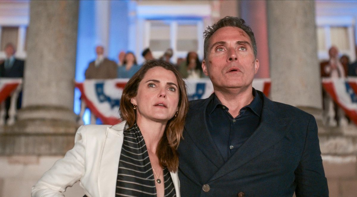 "The Diplomat." (L to R) Keri Russell as Kate Wyler, Rufus Sewell as Hal Wyler in episode 203 of "The Diplomat." Cr. Courtesy of Netflix © 2024