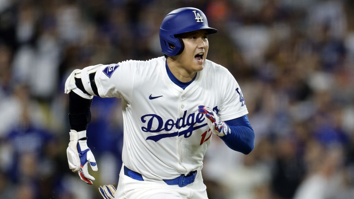 Shohei Ohtani #17 of the Los Angeles Dodgers hits a one run base hit on the way to the MLB Playoffs 2024