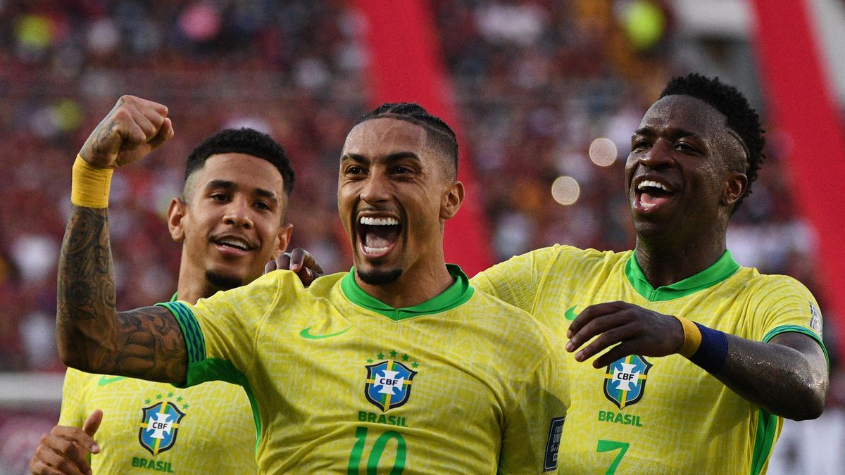 Brazil's forward #10 Raphinha celebrates with teammates forward #20 Savinho and forward #07 Vinicius Jr after scoring during the 2026 FIFA World Cup South American qualifiers going into the Brazil vs Uruguay live stream