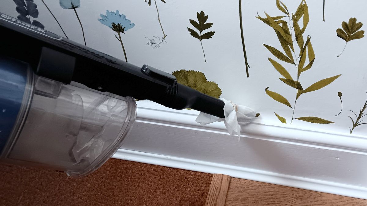 Vacuuming hack cleaning baseboard using dryer sheet