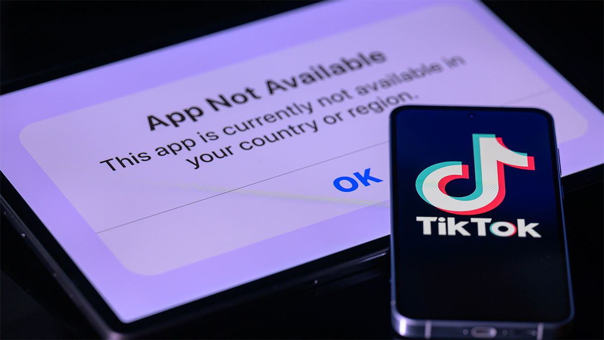 Image of TikTok logo on phone screen and "app not available" message