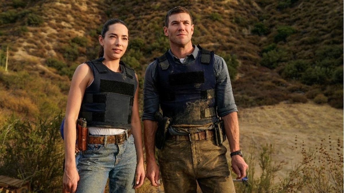 Special Agents "Lala" Dominguez (Mariel Molino) and Leroy Gibbs (Austin Stowell) wearing bulletproof vests and packing heat on a case in Mexico in prequel series "NCIS: Origins".