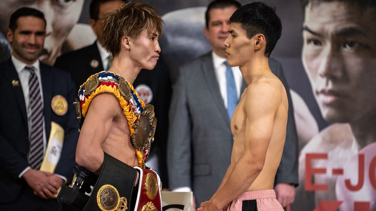 Inoue and Kim face eachother during a weigh-in