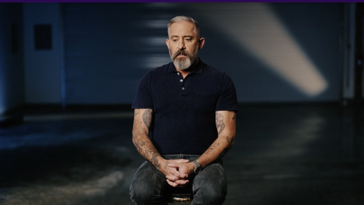 Filmmaker Jeremy Corbell sitting on a stool being interviewed in a scene from "UFO Revolution" season 2 (2025) streaming now on Tubi.