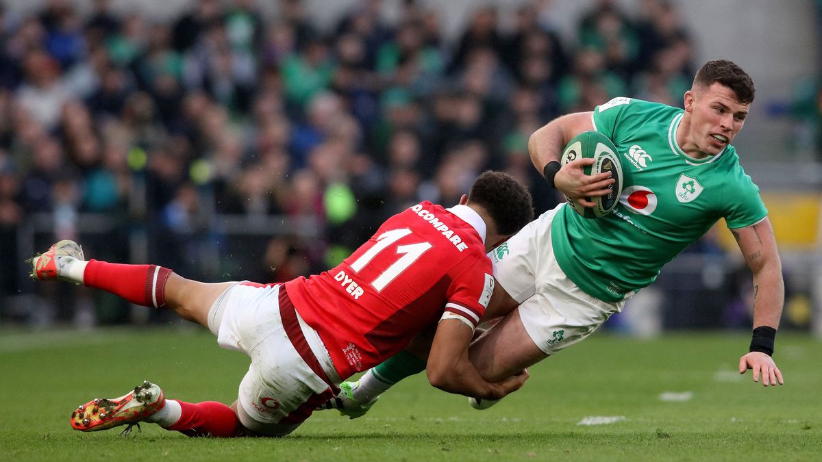 Ireland's Calvin Nash is tackled by Wales' Rio Dyer during the Six Nations 2024 international rugby union match between Ireland and Wales