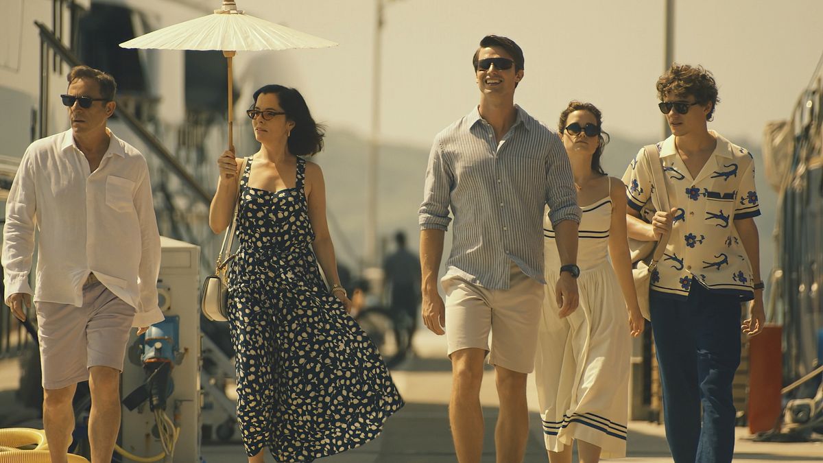 L-R: Jason Isaacs, Parker Posey, Patrick Schwarzenegger, Sarah Catherine Hook, Sam Nivola walk down the street in HBO's "The White Lotus" season 3