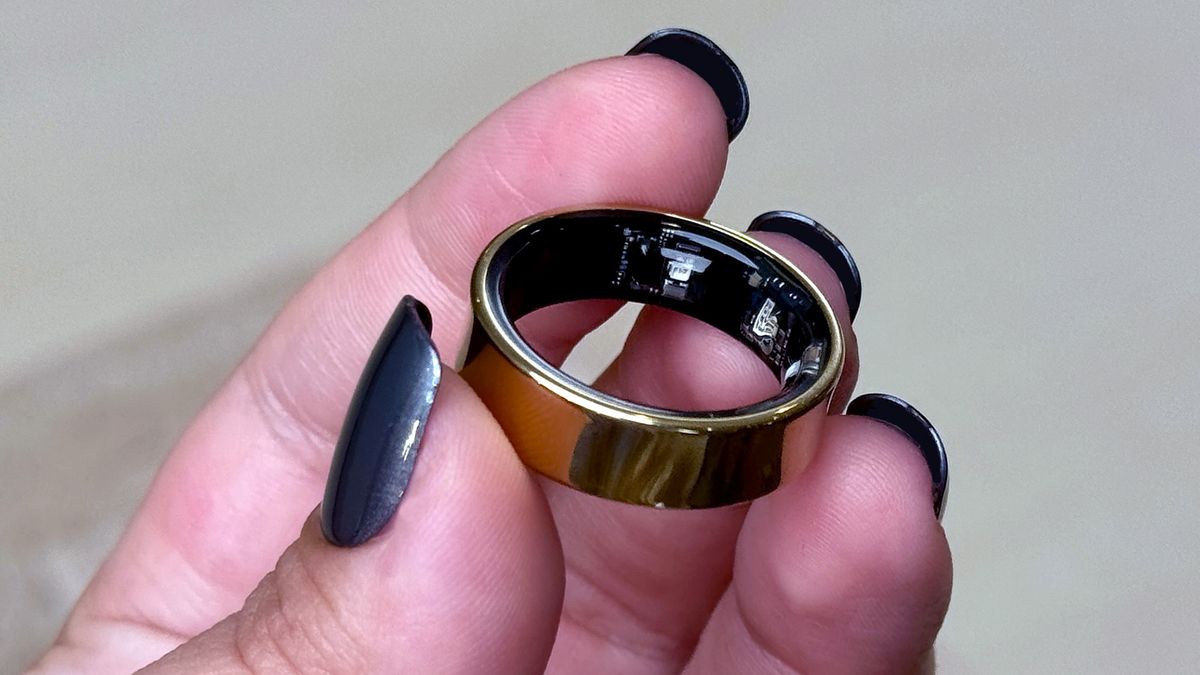 Samsung Galaxy Ring in gold held in a person's hand
