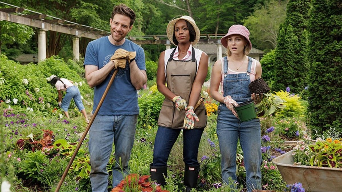 Keen gardeners Brett (Ben Rappaport), Catherine (Aja Naomi King) and Alice (AnnaSophia Robb) stand together in a lush green garden, stopping their digging to appraise someone off screen in comedy drama series "Grosse Point Garden Society."