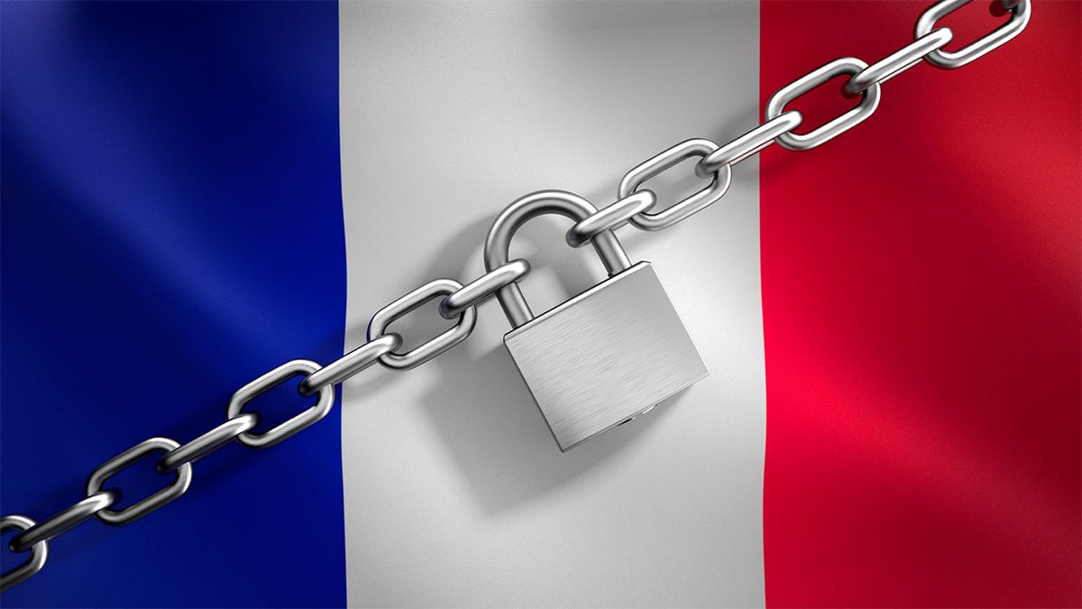 French flag with silver padlock and chain in front of it