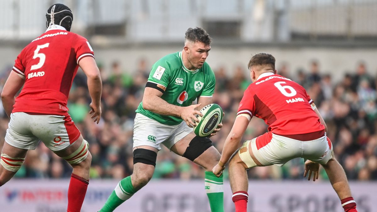 Peter O'Mahony of Ireland in action against Adam Beard, left, and Alex Mann of Wales during Ireland vs Wales in the 2024 Six Nations