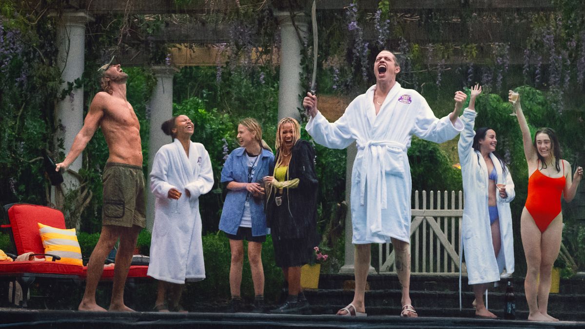 The cast of Bodies Bodies Bodies, including Lee Pace as Greg, Amandla Stenberg as Sophie, Maria Bakalova as Bee, Chase Myha'la Herrold as Jordan, Pete Davidson as David, Chase Sui Wonders as Emma, and Rachel Sennott as Alice, scream and laugh poolside