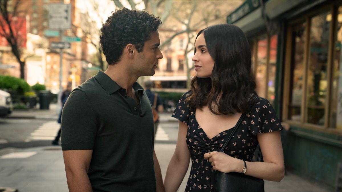 Garrett (Sebastian De Souza) and Alex (Sofia Carson) (L-R) holding hands in Netflix's "The Life List"