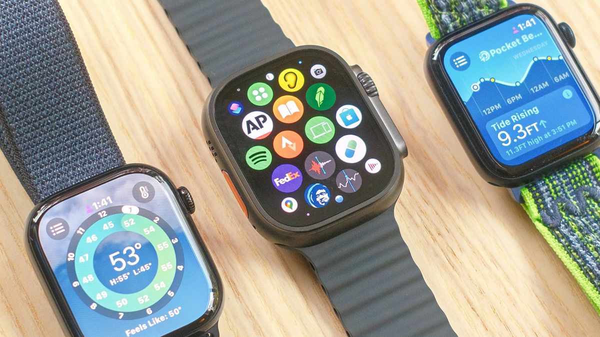 The Apple Watch Series 10, Apple Watch SE and Apple Watch Ultra 2 sitting next to each other on a wooden table