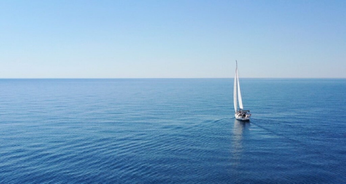 Aerial view of sailing luxury yacht at opened sea at sunny day in Croatia
