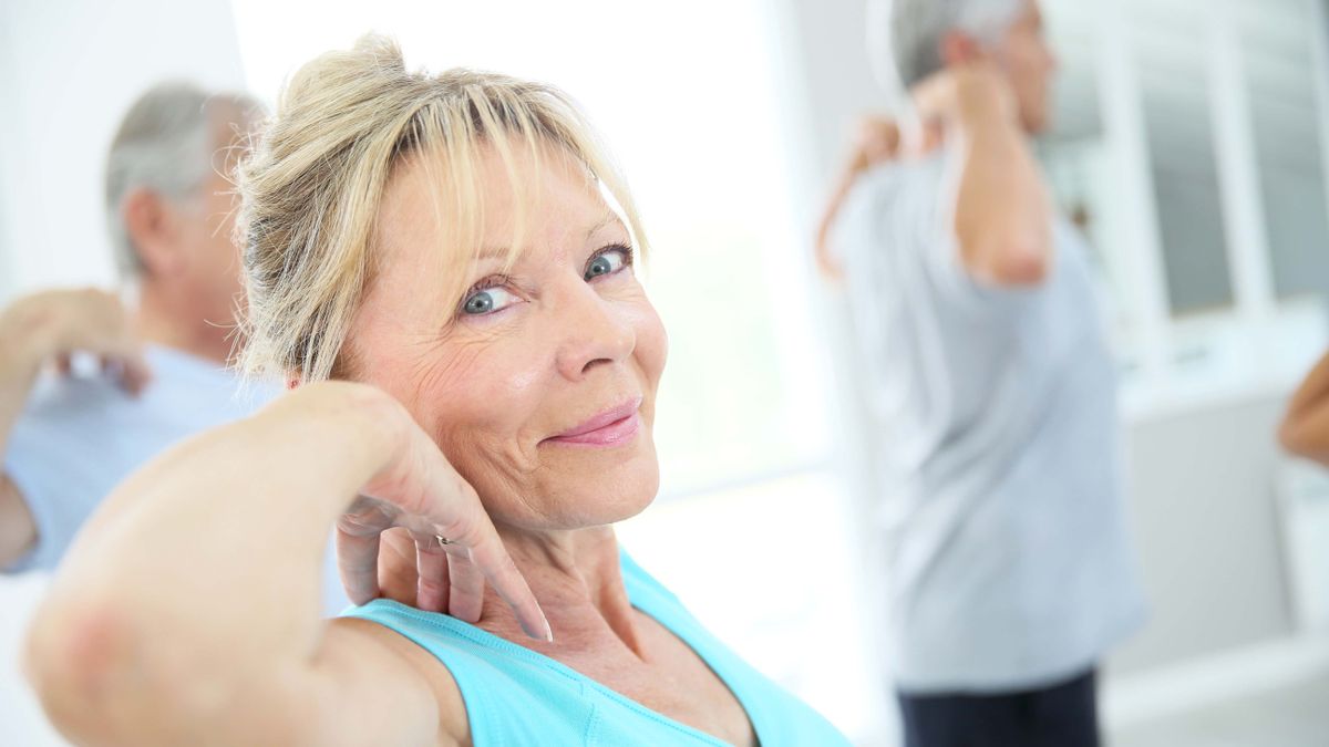 a photo of a woman in her 60's working out