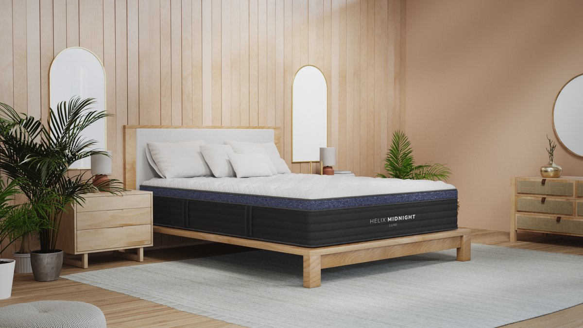 New 2025 Helix Midnight Luxe Mattress on a low profile bed base with mirrors and nightstands on either side