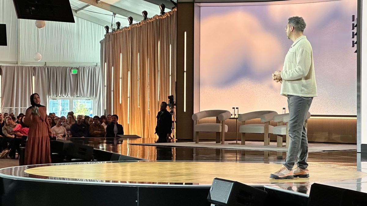 Screenshot of Microsoft livestream moment where a protester interrupts Microsoft Copilot CEO Mustafa Suleyman to shout "blood is on your hands!"