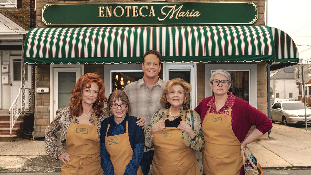 Gia (Susan Sarandon), Teresa (Talia Shire), Joe (Vince Vaughn), Antonella (Brenda Vaccaro) and Roberta (Lorrain Bracco) stand together in front of Enoteca Maria in Netflix's "Nonnas"
