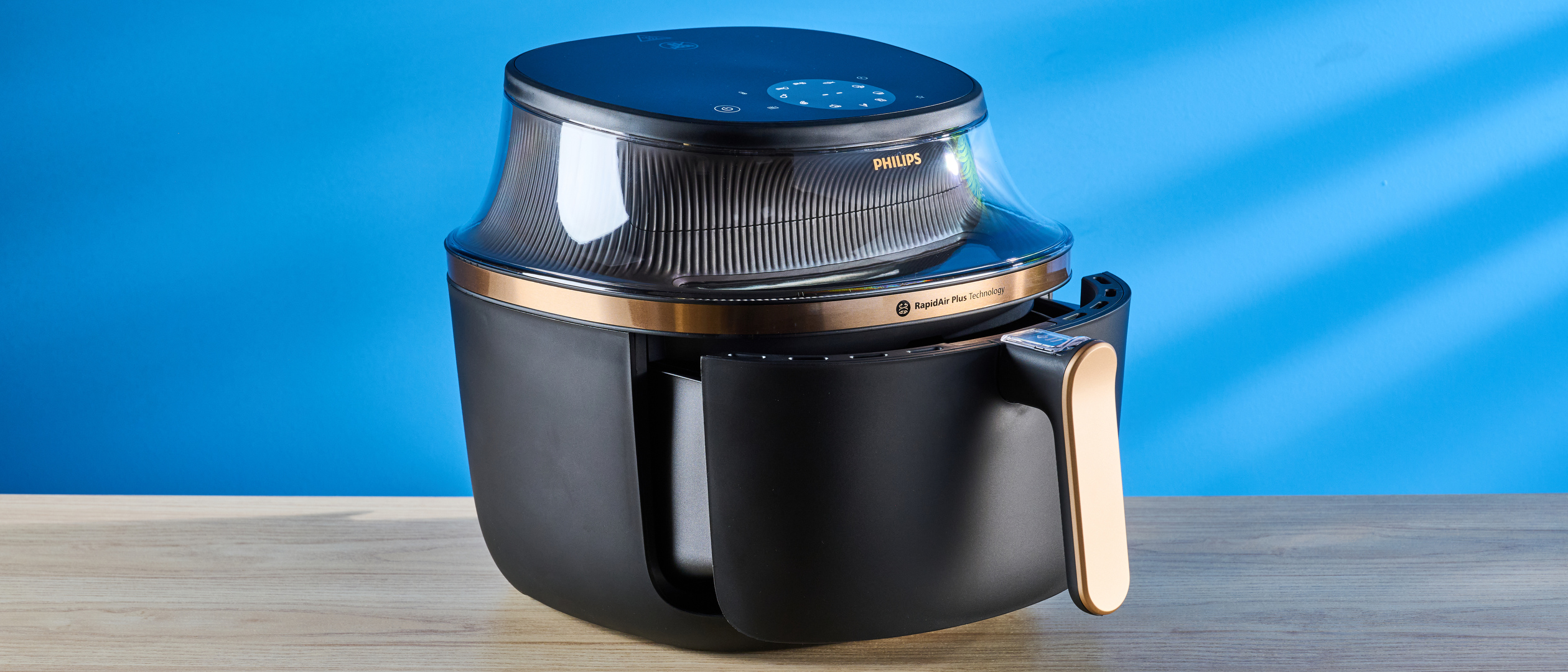 The Phillips Air Fryer 3000 Series pictured in front of a blue background.