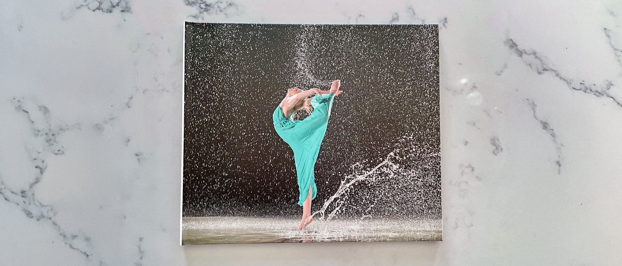 The front cover of a Blurb photo book on a countertop surface