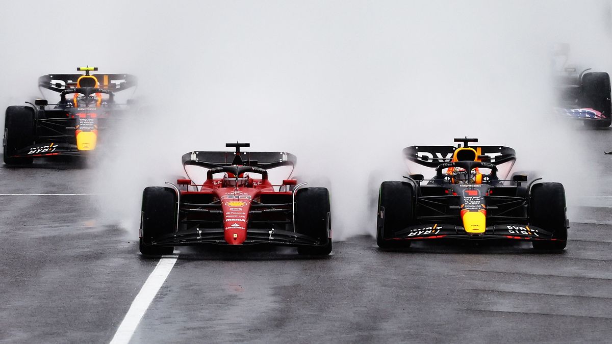 Max Verstappen of the Netherlands and Charles Leclerc of Monaco battle for track position into turn one at the start of the F1 Japanese Grand Prix at Suzuka International Racing Course.