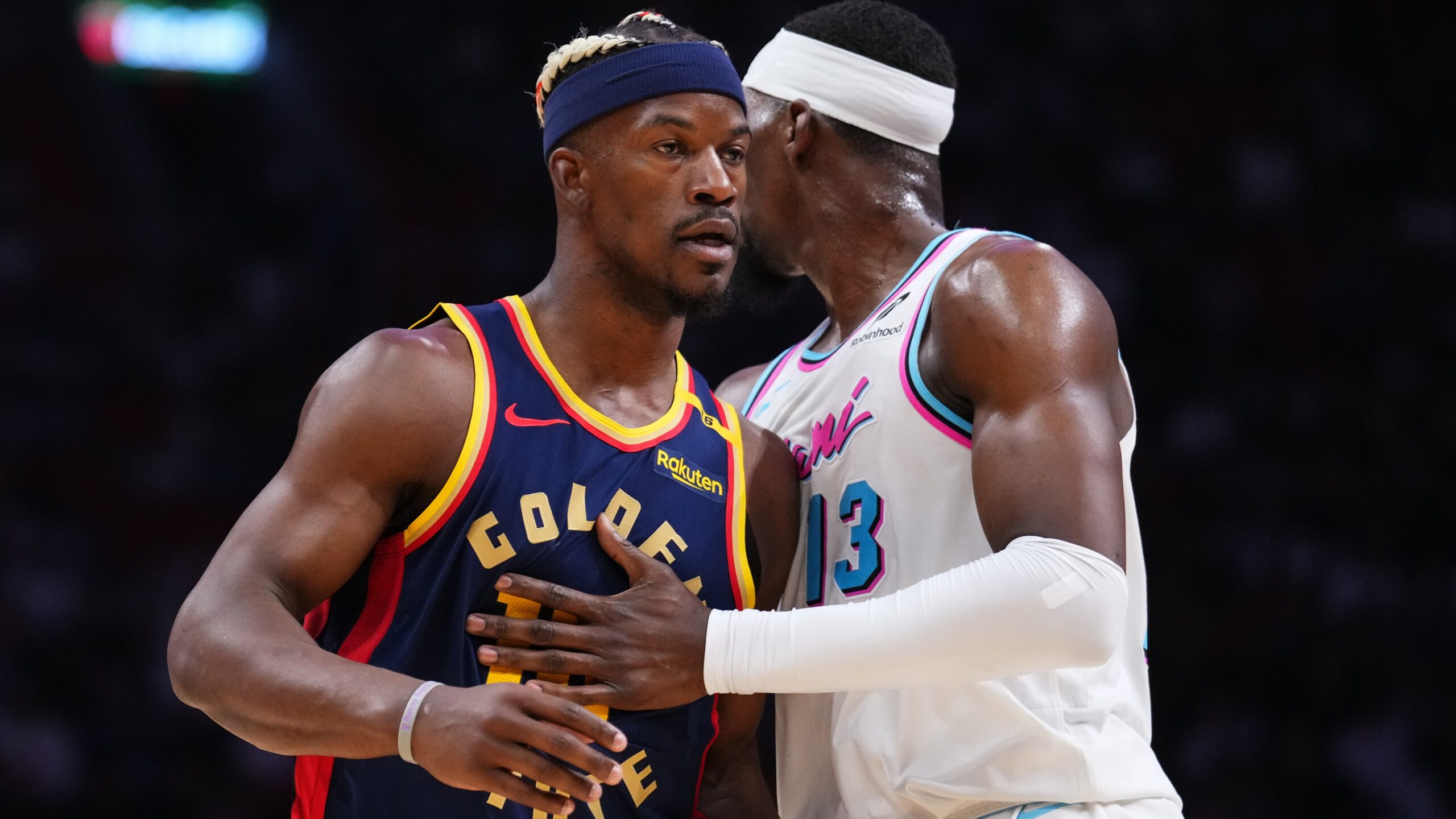 Bam Adebayo #13 of the Miami Heat guards Jimmy Butler III #10 of the Golden State Warriors during the fourth quarter ahead of the NBA Play-in Tournament 2025