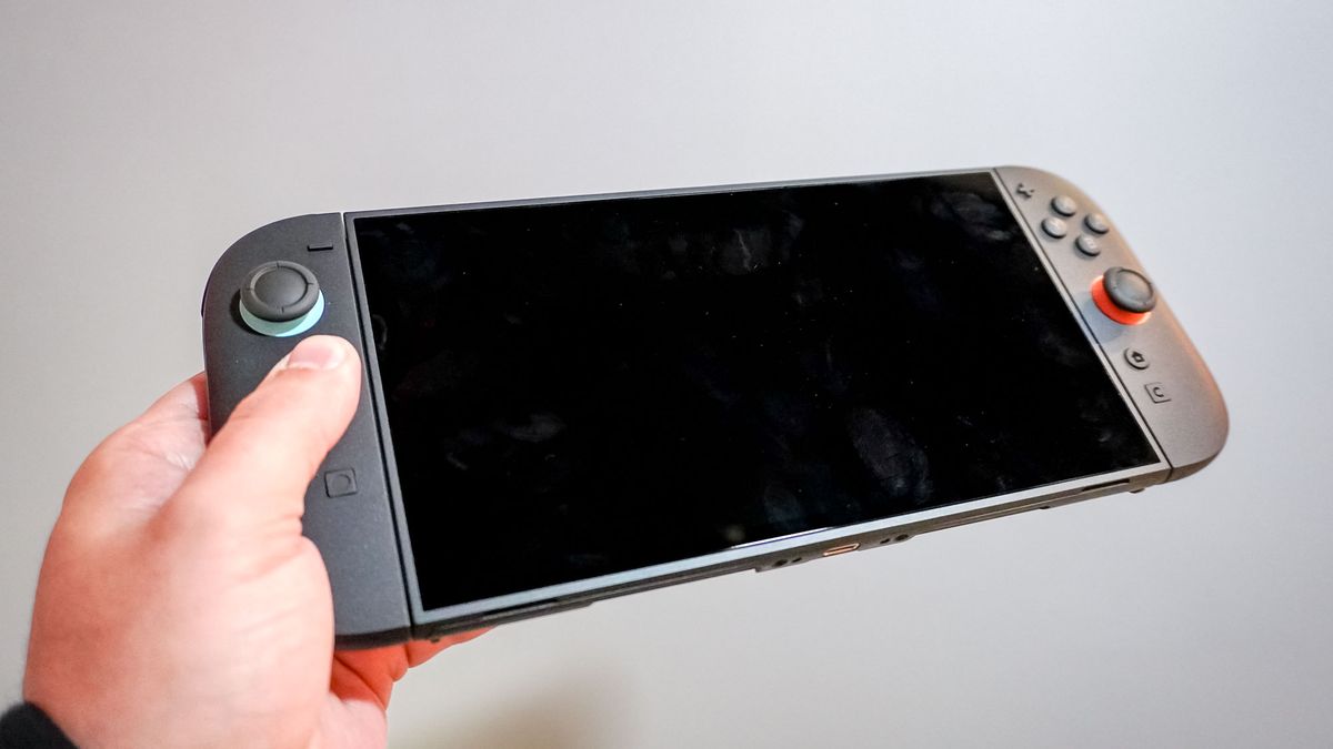 A Nintendo Switch 2 console in hand