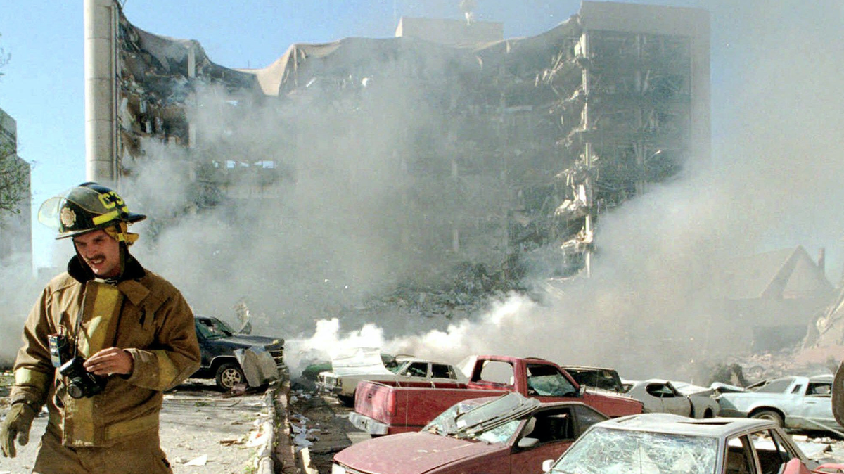 A firefighter amidst the destruction of the Alfred P. Murrah Federal building in Oklahoma